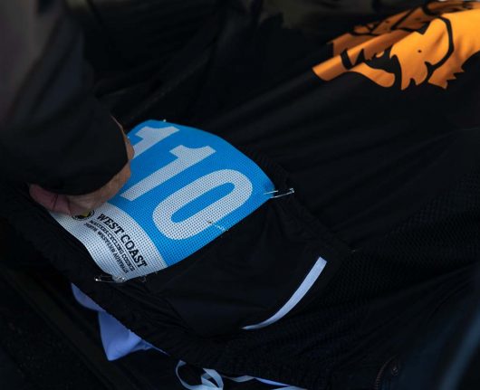 A close up of a rider-'s racing number